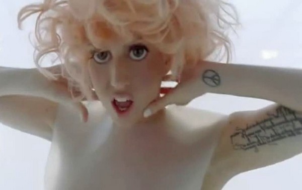 Image from Bad Romance Video Clip showing Gaga's new tattoo on her inner arm