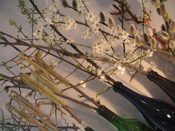 Spring branches with bottles as vases